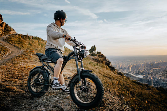 Riding Times Z8 Pro vs Honeywhale K6 Pro. Man on a cliff riding the Z8 Pro.