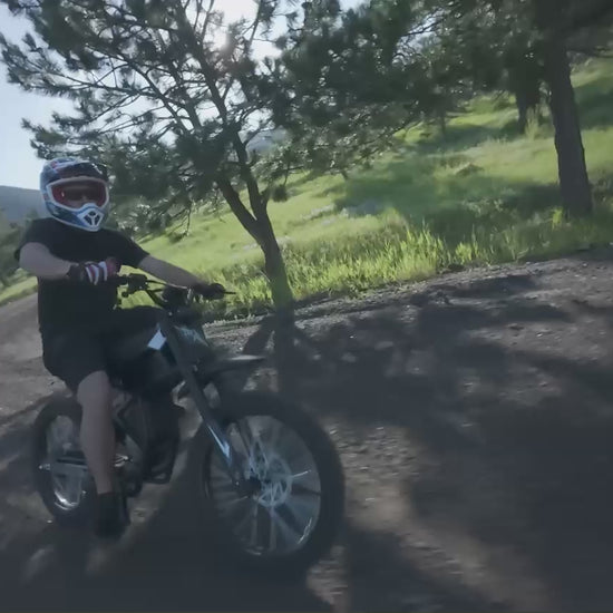GT73  electric motorcycle cruising at high speed on a wide open city road - Street-legal e-bike performance
