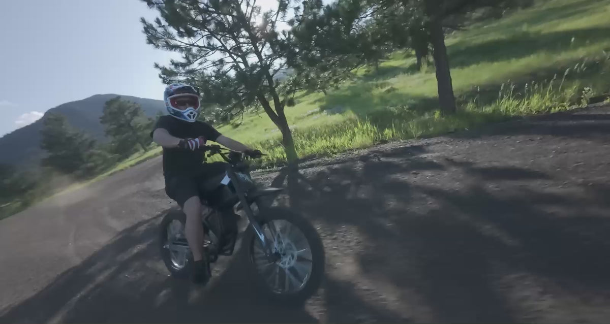 GT73  electric motorcycle cruising at high speed on a wide open city road - Street-legal e-bike performance