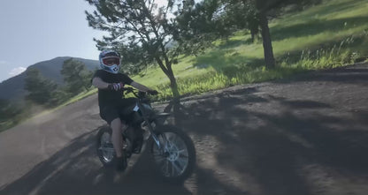 GT73  electric motorcycle cruising at high speed on a wide open city road - Street-legal e-bike performance